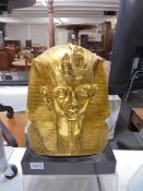 A gilded death mask for Tut-Ankh-Amun.