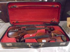 A rare cased pair of antique violins with bows, one with label reading Johann Glass (both a/f)