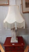 A tall plaster figurine table lamp, titled 'Tuscan' signed M Wood 1946, height 53cm, base 17cm x