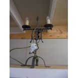 A wrought iron table lamp.
