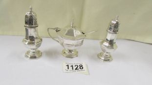 A three piece silver condiment set, 4.2 ounces.