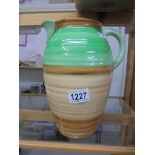 A Shelley green and brown striped jug, 25 cm tall.