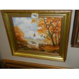A gilt framed oil on board autumn scene with ducks in flight signed C Ray, COLLECT ONLY.