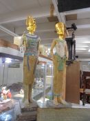 A pair of tall Egyptian figures. COLLECT ONLY.