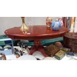 An oval dark wood stained coffee table COLLECT ONLY