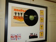 A framed and glazed Beatles disc collage with signatures (not authenticated), COLLECT ONLY.
