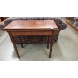 An Edwardian mahogany fold over card table