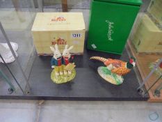 A boxed Royal Doulton 'Reggie and Rex the Rabbits' figure and a boxed John Beswick Pheasant.