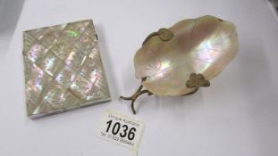 A 19th century mother of pearl card case and an art deco mother of pearl caviar dish.