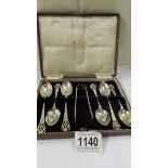 A cased set of six silver teaspoons with sugar tongs, 3.25 ounces.