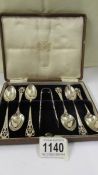 A cased set of six silver teaspoons with sugar tongs, 3.25 ounces.