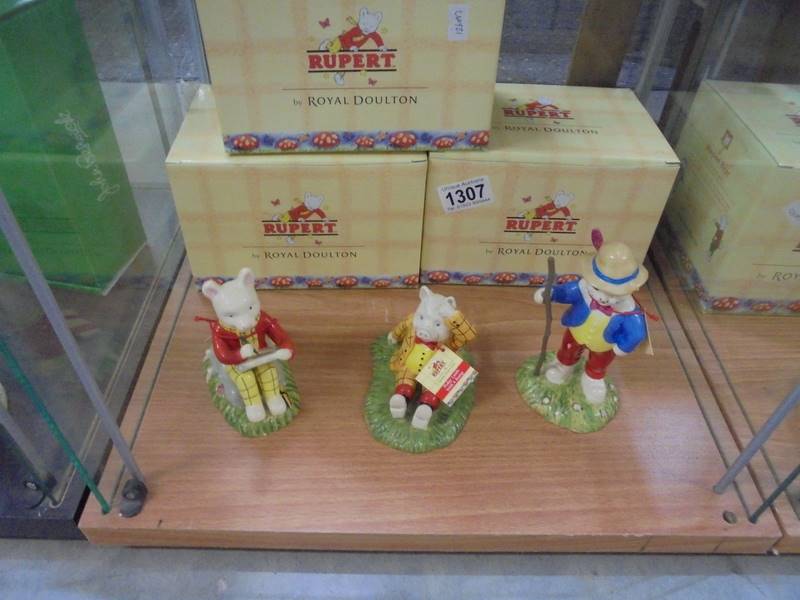 3 boxed Royal Doulton Ruperts"Looking Like robin Hood", "Podgy Lands a Bump" & "Something to Draw"