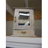 A Victorian limed oak smokers cabinet with silver rimmed ashtray.