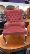 A pink Draylon deep buttoned nursing chair on Queen Anne legs COLLECT ONLY