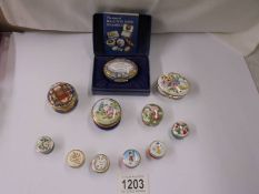 A collection of Halycon Days enamel pill boxes.