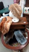 A quantity of fur and faux items including hat and muffs