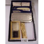 A Durham-Duplex razor, a Rolls razor, Rolls Razor Imperial blades and a cased comb.