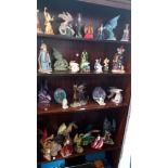 A collection of wizard & dragon figurines - some A/F (4shelves)