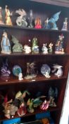 A collection of wizard & dragon figurines - some A/F (4shelves)