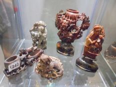 A good lot of carved soapstone animals and figures.