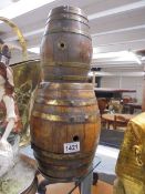 A wooden barrel and a smaller example.