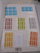 An album containing machine cylinder block sets of stamps.