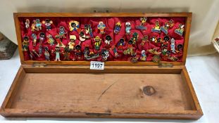 A good collection of Robertsons promotional badges in wooden case.