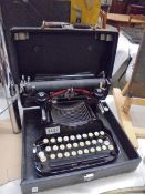 An early 20th century cased Corona Special typewriter.