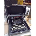 An early 20th century cased Corona Special typewriter.