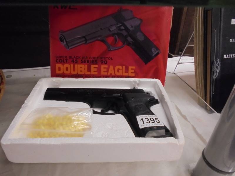 A boxed air soft pistol.