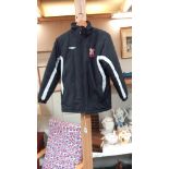 An Umbro Lincoln City jacket, size LB/152cm