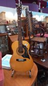 A K.320 acoustic guitar (stand not included) COLLECT ONLY