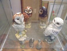 Four Royal Doulton Gleneagles owl decanters (some with contents).