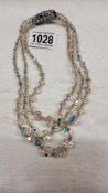 A superb quality three strand crystal necklace.