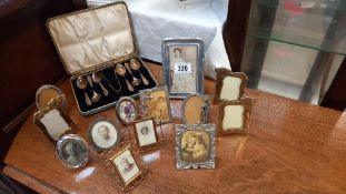 A selection of vintage picture frames including art deco style and a cased set of teaspoons