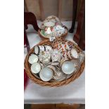 3 vintage tea sets in wicker basket including Royal Worcester plus small basket of cups and