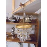 A small three tier chandelier.