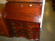 A mahogany concave front bureau. COLLECT ONLY.