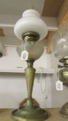 An old oil lamp with frosted glass font and opaque glass shade. COLLECT ONLY.