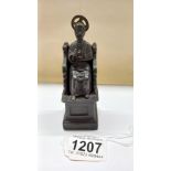 A bronze statue of St Peter on his throne, 11.5 cm tall.