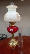 A Victorian style oil lamp with ruby glass font COLLECT ONLY