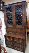 A dark oak bureau bookcase drinking cabinet with drapery front COLLECT ONLY