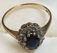 A 9ct Gold Sapphire and Diamond ring (the diamonds being chip surmounted to ring)