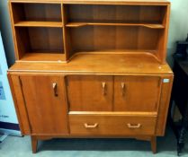 A 1950's light oak wall unit/sideboard with cupboard/drawer base with sliding cutlery tray & open