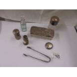 A pair of silver sugar tongs, a silver lidded trinket box, a bottle stopper etc.,