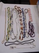 Seven opera length necklaces and four others.