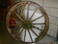 A heavy Victorian cart wheel. COLLECT ONLY.