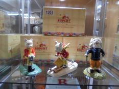 3 boxed Royal Doulton Ruperts "Out for the Day" "Rupert Takes a Skiing Lesson" & "Leading the Way"