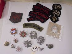 A mixed lot of fire brigade related badges.