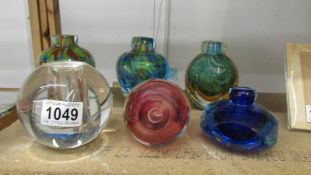 Six studio glass bud vases in various colours.